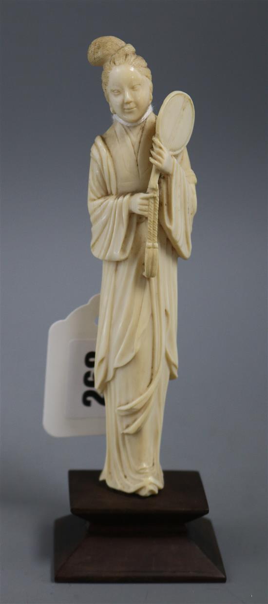 A Chinese carved ivory figure of a lady, height 19cm 19cm (overall)